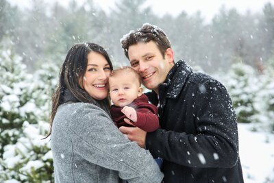 Parents in the snow with baby | Family Photography Session