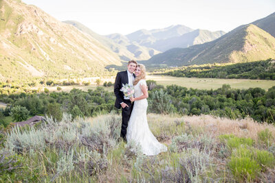 Beautiful Wedding couple posed in front of a Stunning Mountain  view in Hobble creek Canyon