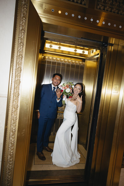 Elopement Photography, couple showing off their rings as they get into an elevator