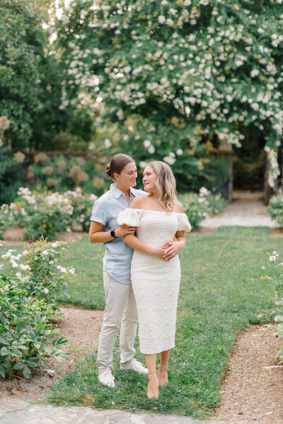 bride and groom walking hand in hand in garden at hotel du village