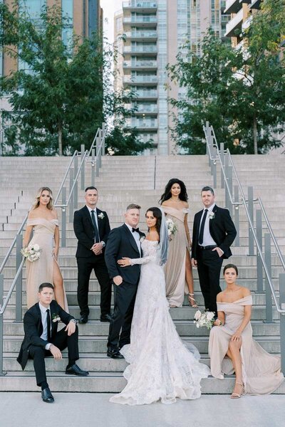 Stylish bridal party posing on city stairs in Burlington, photographed by Toronto-based photographer