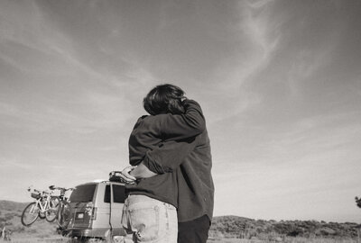 Two people hug standing outdoors. Representing Boise Experiential Therapy Collective vendor profile for the Crush Collective wedding show.