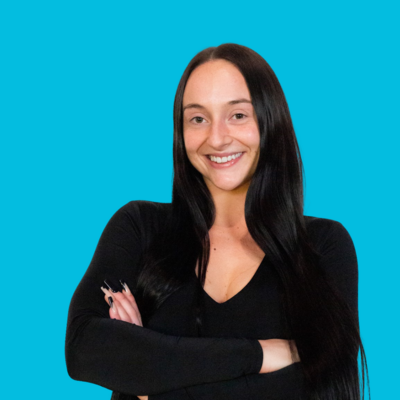 Drop-in/Case Manager of Move Forward who is a white woman with long dark hair wearing a blakc longsleeved shirt