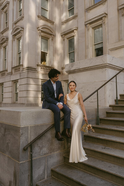 bride and groom outside of city hall during NYC elopements shot by Elsie Goodman Photography | NYC Elopement Packages