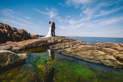 Couple are kissing during their Nordic elopement wedding abroad