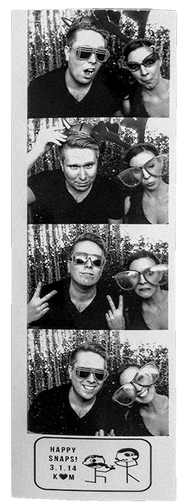 man and woman in a photobooth