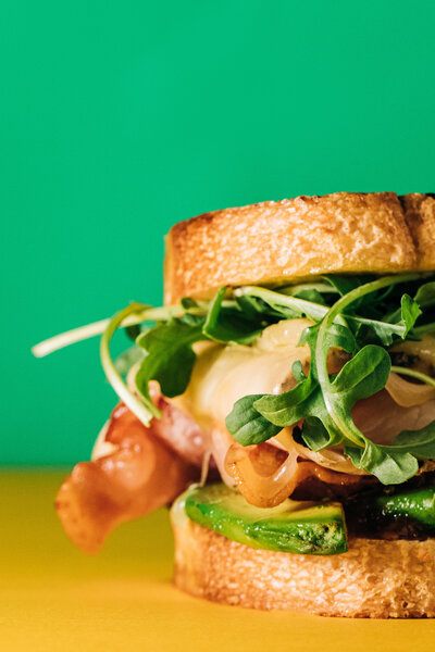 This client project for Good Day Cafe in Oxford, MS included a food styling shoot for their menu. One of their most popular menu items is the Good Turk sandwich. This sandwich has turkey, avocado, bacon, swiss, arugula, rosemary aioli & tomato jam.
