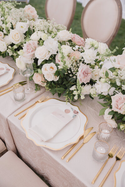 A pink and gold table setting for a Hamptons wedding