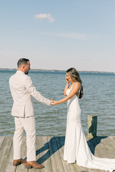 Groom wiping tears after first look at Rosewood Farms wedding, PA.