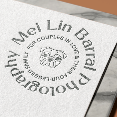 Paper embossed with Mei Lin's logo.