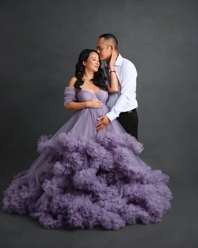 Maternity photoshoot in West Palm Beach of pregnant mom in beautiful pink couture gown.