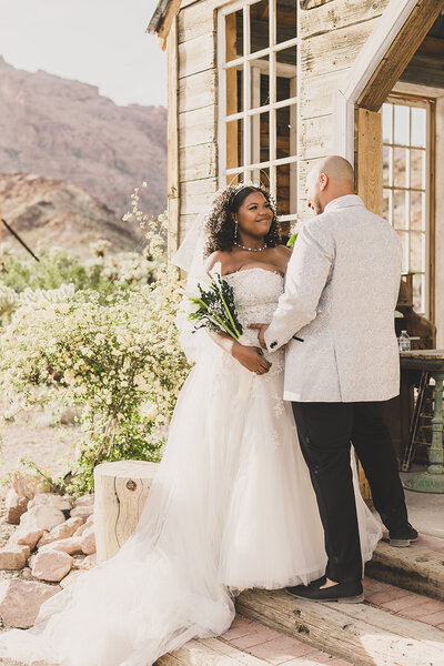 bride and groom pose for pictures after wedding in las vegas