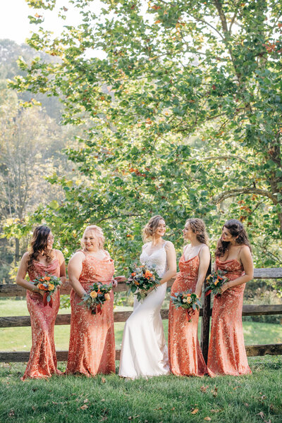 bride laughs with bridal party for weddings on her NJ wedding day