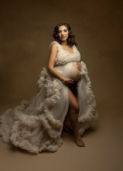 Expecting mother in a couture gown for a maternity session in Charleston, South Carolina.