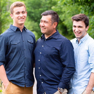 father and two sons laughing captured by Ottawa Wedding & Portrait Photographer JEMMAN Photography