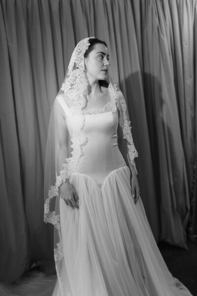 Bride with back turned in open back dress