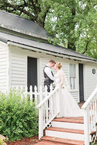 Bride and Groom sharing their first kiss during outdoor wedding