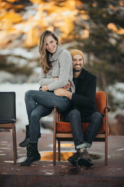 husband and wife brand photoshoot sitting outside on chairs