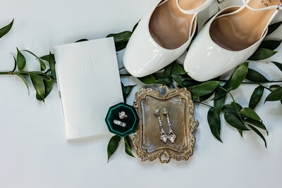 Flat lay with greenery and white shoes