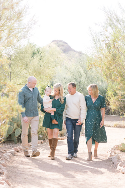 family photo session walking together on the trails of Desert Botanical Gardens in Arizona