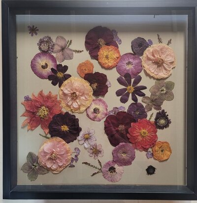 Handcrafted floral preservation art by Leigh Florist, capturing vibrant wedding bouquet flowers in a modern design.