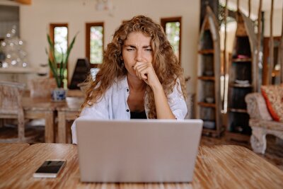 Laptop on desk with a list of  discounts for apps