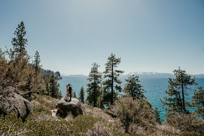 bride and groom kissing on a rock after their elopement at logan shoals vista point.