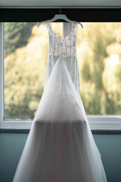 Bride’s shoes and wedding dress detail photo for full day coverage package, Manchester and Liverpool wedding photographer