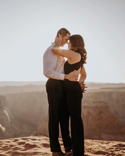 Man and women holding each other in the desert