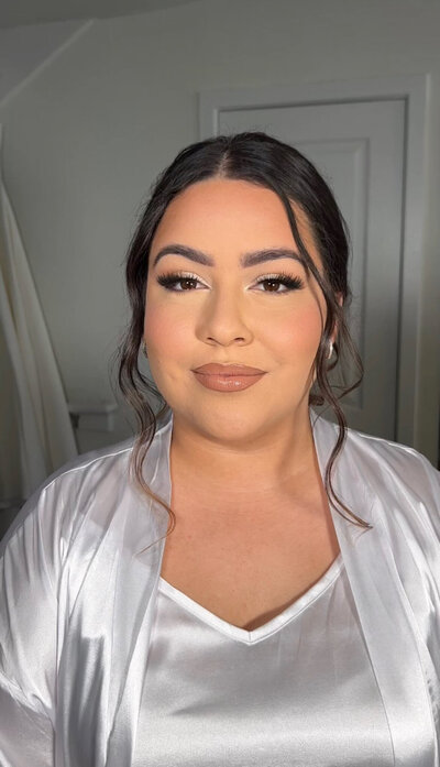 Bride with soft glam makeup and elegant updo highlighting Blushed Miami’s expertise in bridal beauty styling.