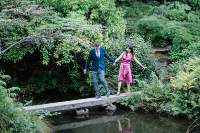Romantic engagement photos at Kubota Garden, 12 best spots for engagement photos in Seattle with an intimate garden, red bridge and fun setting for couples in love