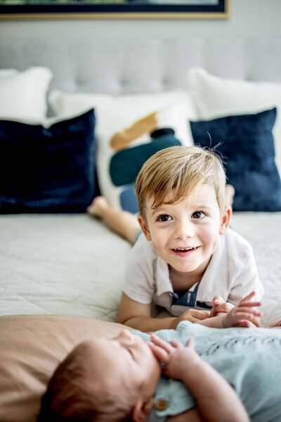 three year old with new baby brother