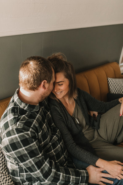 couple smiling on couch