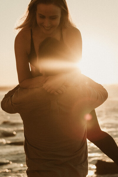 Cinematic portrait by Sunshine Coast photographer, capturing a woman in soft backlight and shadow.