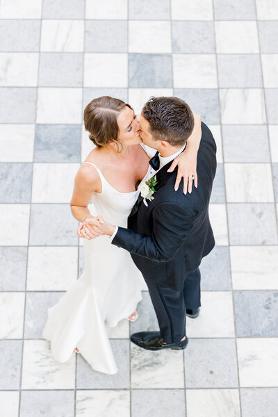 bride and groom portrait on checkered floor at the william aiken house