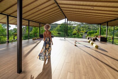 woman walking on a yoga deck 