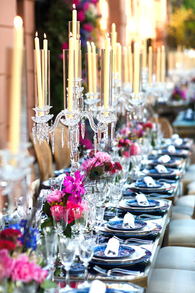 Elegant wedding tablescape with gold accents, white linens, fine china, and floral centerpieces, designed by In Full Bloom Event Planning & Design.