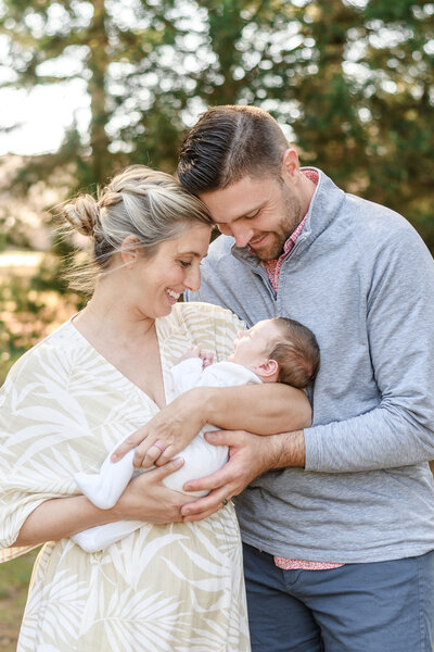 Mom and dad holding their newborn
