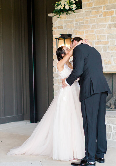 Bride and groom kissing at Brentsville Hall in Manassas, Virginia. Captured by Washington DC Wedding Photographer Bethany Aubre Photography.