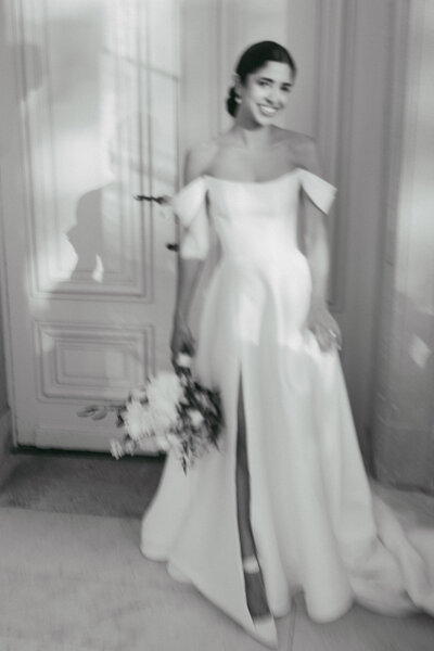 A motion blur photo of a bride with a film aesthetic, shot by Stacey Vandas Photography