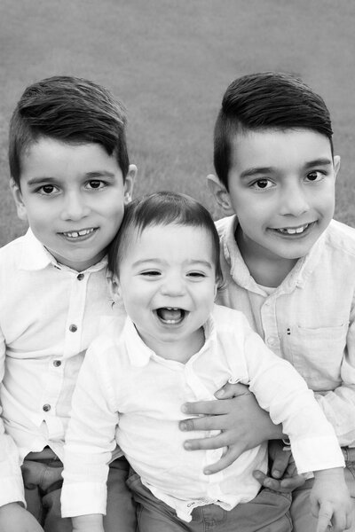 Hawthorn East family photographer capturing natural portraits of siblings playing