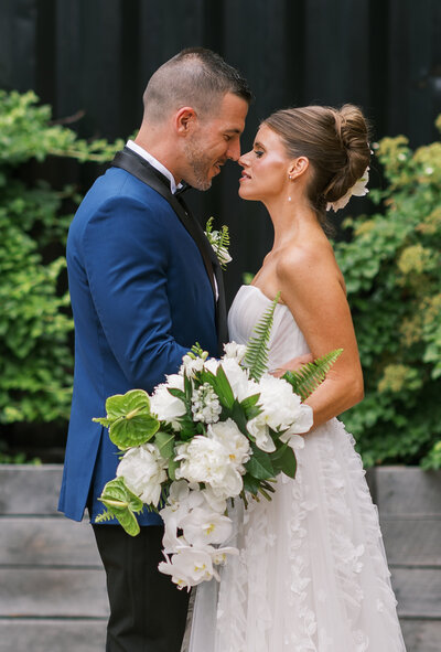 A bride and groom during their first look. The photo is true to color and outside their wedding venue in Lexington, Ky 