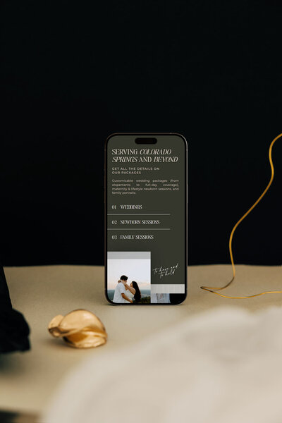 Iphone standing up showing showit web design for luxury photographers, Palme Design Co
