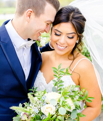 couple in front of hydrangeas