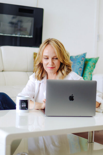 woman on computer smiling