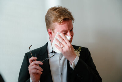 Guests sitting at a wedding ceremony clapping