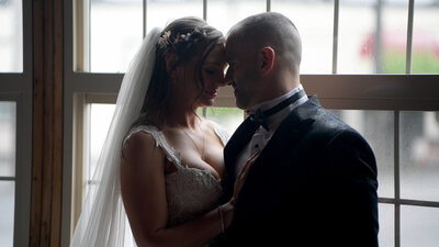 bride and groom embracing
