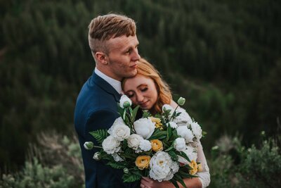 Lake Tahoe Elopement Photographer captures bride holding bouquet of flowers