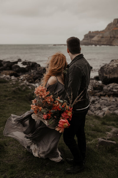 bride and groom embracing at Giant's Causeway