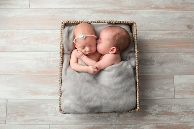 twins newborns laying in basket at their Detroit Newborn Photography session with Kat Figlak